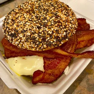 Toasted Everything Bagel with Bacon - Over-Easy Eggs and Cheese