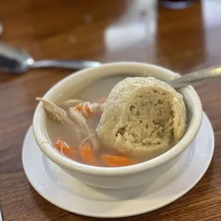 Cup of chicken soup with matzo ball
