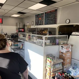 a woman standing in front of a counter