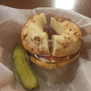 Lox with cream cheese, red onion, and capers on an onion bagel