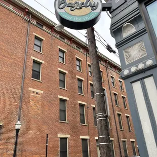 a red car parked in front of a brick building
