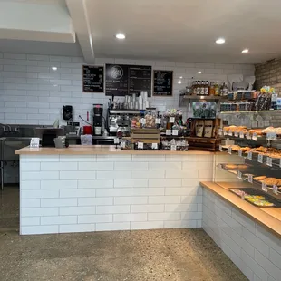 a bakery with a counter and shelves