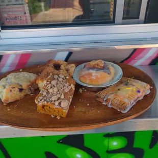 Their baked goods for display. Scones, coffee cake, cinnamon roll, and pop tart! Looks heavenly!