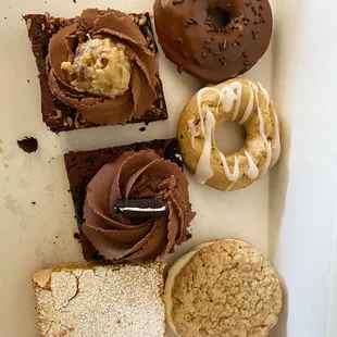 Oreo &amp; German chocolate brownies, oatmeal cookie sandwich, green chile and chocolate donuts, and lemon bar.