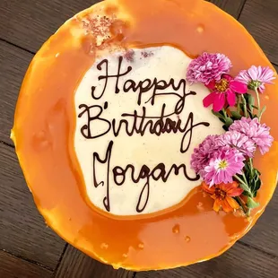 Vanilla Bean Latte cake   Vanilla latte soaked white cake, vanilla bean buttercream, chocolate center, caramel drizzle.