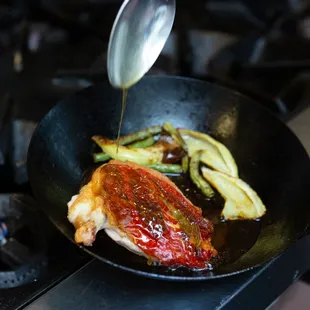 a pan of food being cooked