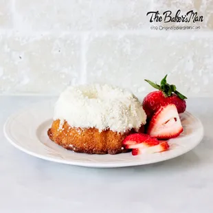 a plate of cake and strawberries