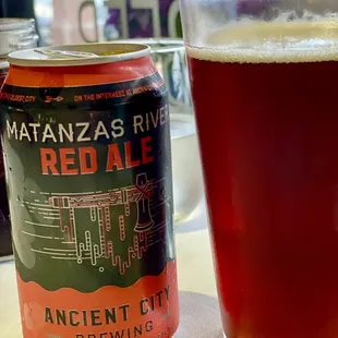 a can and a glass of beer