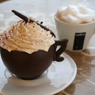 a cup of coffee with whipped cream