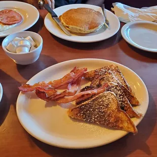 French Toast, bacon, pancakes, ham eggs over easy.