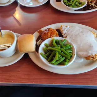 Chicken fried steak lunch special with mashed potatoes, green beens, broccoli and cheese soup, and a roll. For an insanely cheap $8.19.