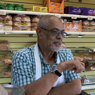 One of the owners taking time to talk to customers about their products.