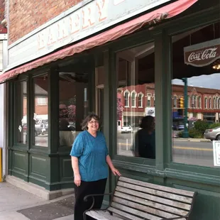 a woman sitting on a bench