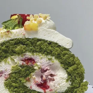 single roll cake: matcha sponge cake, vanilla cream, fresh mixed berries in middle, yuzu curd + strawberries (07/2021)