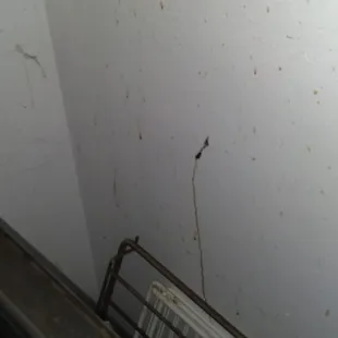 the wall next to the grill