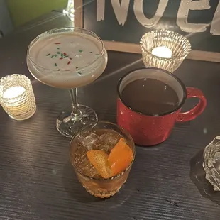 two cocktails and a candle