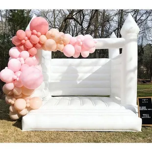 White bounce house with garland