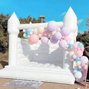 White bounce house with garland