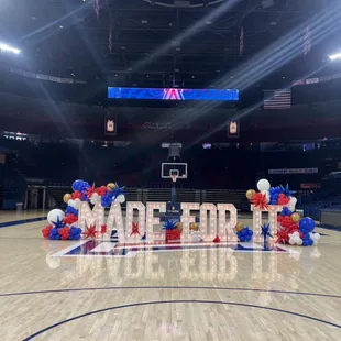 Marquee letters and balloons at the UofA basketball center