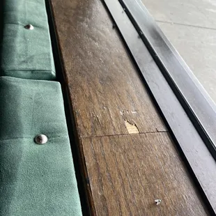 a wooden bench and a window