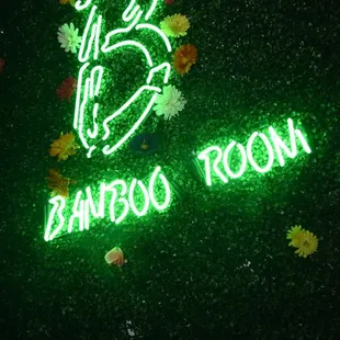 the neon sign for bamboo room