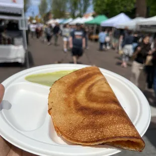 a person holding a plate of food