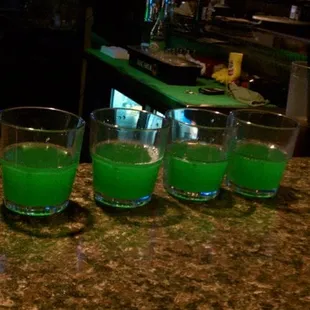green liquid in glasses