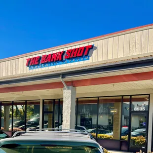 a car parked in front of a bank