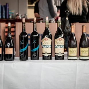 a table full of wine bottles