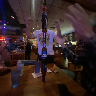 a man holding a beer