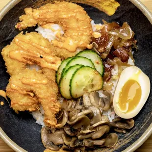 a bowl of food on a wooden table