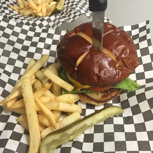 Delicious burgers with 60/40 Brisket Angus mix need on a pretzel bun.