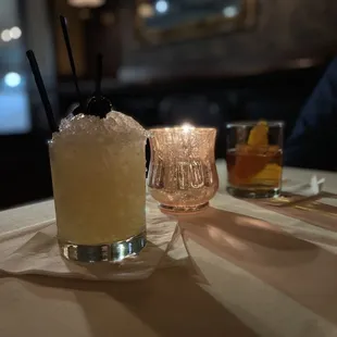 a cocktail with a garnish