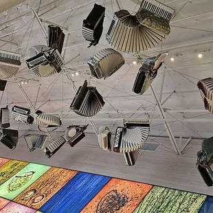 accordions hanging from the ceiling