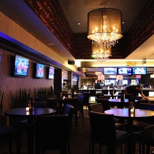 a bar with a chandelier