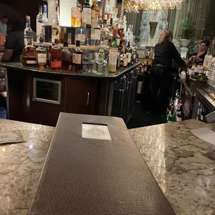 a laptop on the bar