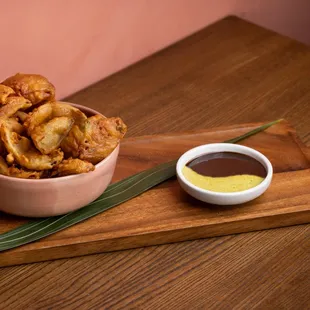 Onion Petals with tamarind-cashew sauce and herb chutney