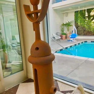 Art  1 of 3  heavy metal in the hotel lobby overlooking the pool