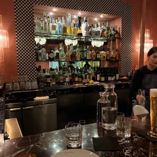 Sitting at their cute bar top with some great cocktails in hand.