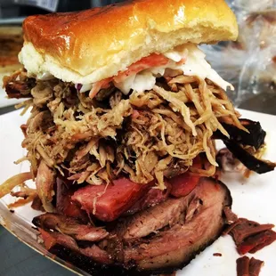 Come try our big ED sandwich!  Brisket, Sausage, Pulled Pork toped with Coleslaw!