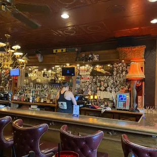 a woman behind the bar