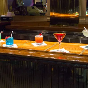 a variety of cocktails on the bar