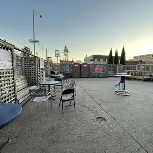 tables and chairs on a concrete patio