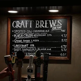 a chalkboard with a list of craft brews