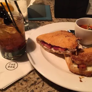 a sandwich and a drink on a table