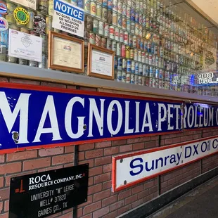 a brick wall with a sign that says magnolia petroleum