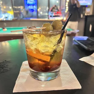 a drink with olives in it