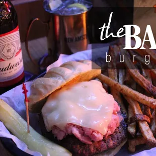 Home of "The Bar Burger" Ham and swiss cheese piled on top of a 1/2 pound burger. Don't forget the fresh cut french fries.