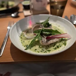 Black bass with shelling beans, anchovy broth and winter chicories