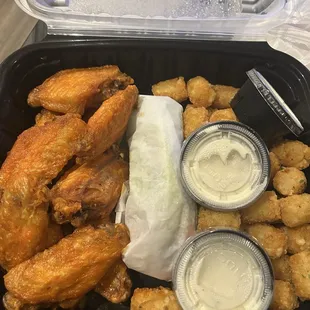 medium buffalo wings extra crispy all flats cane w ranch an carrots n celery w tots